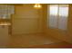 Bright dining room with tile floors, window, chandelier and light yellow walls at 108 Zenith Point Ave, North Las Vegas, NV 89032