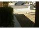 View of the front yard featuring rock landscaping and a peek at the street at 108 Zenith Point Ave, North Las Vegas, NV 89032