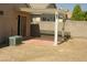 Covered patio with concrete slab and desert landscaping at 108 Zenith Point Ave, North Las Vegas, NV 89032