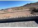 Paver patio offering expansive views of desert landscape and distant mountains beyond low walls at 117 Forest Ln, Boulder City, NV 89005