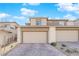 Modern two-story home with attached two-car garage and paver driveway at 11713 Redwood Mountain Ave, Las Vegas, NV 89138