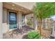 Modern teal front door with covered entryway and landscaped courtyard at 11713 Redwood Mountain Ave, Las Vegas, NV 89138