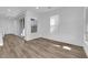 Bright and airy living room with wood-look flooring and sliding glass doors at 11713 Redwood Mountain Ave, Las Vegas, NV 89138