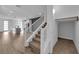 Modern staircase with white railings and carpeted steps at 11713 Redwood Mountain Ave, Las Vegas, NV 89138