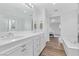 Bathroom with double vanity, soaking tub, and tiled shower at 11908 Love Orchid Ln, Las Vegas, NV 89138