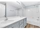 Bathroom featuring double sinks, vanity, and shower-tub combo at 11908 Love Orchid Ln, Las Vegas, NV 89138