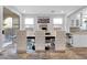 Elegant dining area features stylish chairs, modern lighting, and patio access at 11908 Love Orchid Ln, Las Vegas, NV 89138