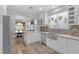 Bright kitchen featuring modern appliances, an island, and sleek white cabinetry at 11908 Love Orchid Ln, Las Vegas, NV 89138