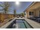 Backyard featuring a narrow pool with integrated waterfall at 12 Hilltop Crest St, Henderson, NV 89011