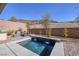 Backyard oasis with a pool, a fire pit, and an outdoor grill at 12 Hilltop Crest St, Henderson, NV 89011