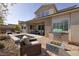 Backyard retreat featuring an outdoor kitchen and fire pit at 12 Hilltop Crest St, Henderson, NV 89011