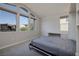 This bedroom is well lit by large windows and features a built in desk and cabinets at 12 Hilltop Crest St, Henderson, NV 89011