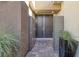 Inviting front entrance with double doors, gray privacy screens and a brick-paved entryway at 12 Hilltop Crest St, Henderson, NV 89011