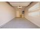 Clean two-car garage featuring epoxy floors and storage shelving with natural light at 12 Hilltop Crest St, Henderson, NV 89011