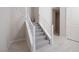 Carpeted staircase featuring modern railing design and light wood flooring at 12 Hilltop Crest St, Henderson, NV 89011