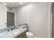 This stylish bathroom features a sleek blue countertop, a single sink and a shower at 1312 Enchanted River Dr, Henderson, NV 89012