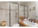 Modern bathroom with walk-in shower, vessel sink, and decorative lighting at 1312 Enchanted River Dr, Henderson, NV 89012