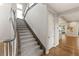 Elegant foyer with staircase and hardwood floors at 1312 Enchanted River Dr, Henderson, NV 89012