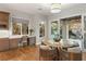 Cozy kitchen nook with a built-in desk, breakfast table, and sliding doors to an outdoor retreat at 1312 Enchanted River Dr, Henderson, NV 89012