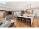 Open-concept kitchen flows seamlessly into the living area with a large island and bar stool seating at 1312 Enchanted River Dr, Henderson, NV 89012