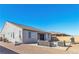 Wide backyard view featuring a concrete patio with outdoor seating and a barbecue grill at 136 Mosso Niente Pl, Henderson, NV 89011