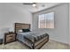 Cozy bedroom featuring a modern bed frame, soft carpet, and a ceiling fan at 136 Mosso Niente Pl, Henderson, NV 89011