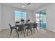 Bright dining area with stylish seating, natural light, and seamless indoor-outdoor transition at 136 Mosso Niente Pl, Henderson, NV 89011