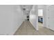 Neutral hallway with tile flooring leading to a bedroom with light-filled interiors at 136 Mosso Niente Pl, Henderson, NV 89011