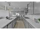 Spacious kitchen with stainless appliances, grey cabinets, and modern countertops at 136 Mosso Niente Pl, Henderson, NV 89011