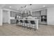 Spacious kitchen with a center island, stainless steel appliances, and sleek gray cabinetry at 136 Mosso Niente Pl, Henderson, NV 89011