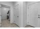 Hallway featuring laundry room with stacked washer and dryer at 136 Mosso Niente Pl, Henderson, NV 89011