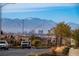 View of distant mountains and the Las Vegas skyline from neighborhood street at 136 Mosso Niente Pl, Henderson, NV 89011