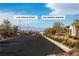 Neighborhood street view showcasing the Las Vegas Strip in the distance at 136 Mosso Niente Pl, Henderson, NV 89011