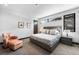 Comfortable bedroom with neutral tones and a cozy seating area at 1786 Diamond Rim Ct, Henderson, NV 89012