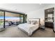 Main bedroom featuring a sliding glass door with patio, city views and ensuite bathroom at 1786 Diamond Rim Ct, Henderson, NV 89012