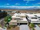 Modern home exterior with xeriscaped front yard, showcasing clean lines and desert landscaping at 1786 Diamond Rim Ct, Henderson, NV 89012