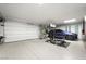 Organized garage with a modern design and space for parking and a home gym at 1786 Diamond Rim Ct, Henderson, NV 89012