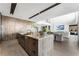 Open kitchen features a large center island with sink and seating that flows seamlessly into the living space at 1786 Diamond Rim Ct, Henderson, NV 89012