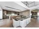 Bright, modern kitchen features a large island, stainless steel appliances, and an adjacent dining area at 1786 Diamond Rim Ct, Henderson, NV 89012