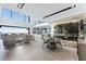 Spacious living room with a wall-to-ceiling wine storage and panoramic city views at 1786 Diamond Rim Ct, Henderson, NV 89012