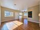 Bright, open-concept living room featuring hardwood floors and an adjoining kitchen area for seamless entertaining at 1851 Hillpointe Rd # 2124, Henderson, NV 89074