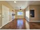 Open-concept living room with hardwood flooring, ceiling fan, and lots of natural light at 1851 Hillpointe Rd # 2124, Henderson, NV 89074