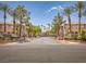 View along a street with desert landscaping showing condo buildings on either side at 1851 Hillpointe Rd # 2124, Henderson, NV 89074