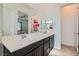 Stylish bathroom with double sinks, modern fixtures, and a view into the bedroom at 216 Copland Canyon Ave, Henderson, NV 89011