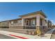 Charming single-story home featuring a covered porch and well-maintained landscaping at 216 Copland Canyon Ave, Henderson, NV 89011