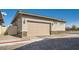 Attached two-car garage with brick-accented exterior at 216 Copland Canyon Ave, Henderson, NV 89011