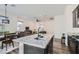 Modern open-concept kitchen with granite counters overlooking the dining and living areas at 216 Copland Canyon Ave, Henderson, NV 89011