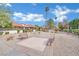 Charming community area with benches, palm trees, walkway and lush landscaping at 2541 La Cara Ave, Las Vegas, NV 89121