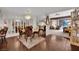 Open concept dining area with elegant chandelier and mirrored accent wall at 2541 La Cara Ave, Las Vegas, NV 89121