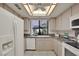 Bright kitchen with white appliances and granite countertops at 2541 La Cara Ave, Las Vegas, NV 89121